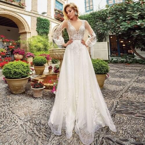Charming A-Line Long Sleeve Wedding Dresses 2021 Sheer O-Neck Lace Appliques Boho Bridal Gown With Button Back Illusion Tulle
