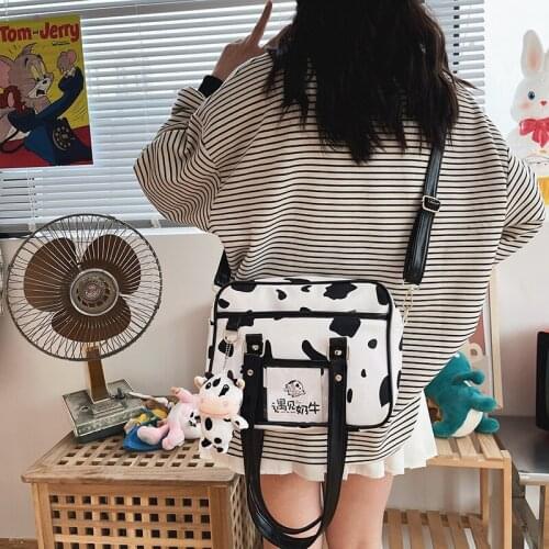 Cute cartoon hit color cow wave dot female handbag light student one-shoulder diagonal bag change mobile phone storage bag