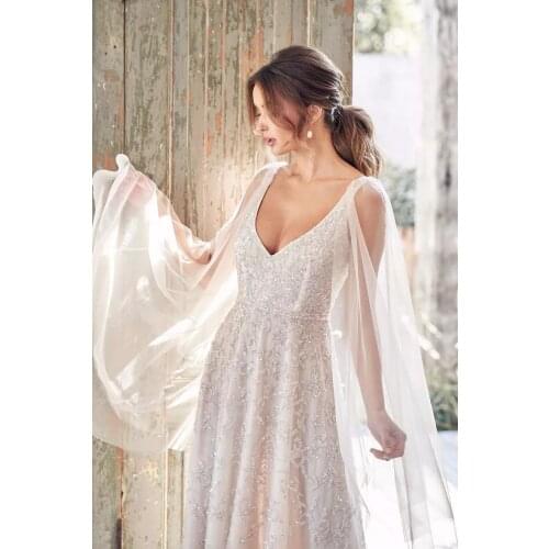 Vestido de novia de princesa brillante, cuello en V, lazo sin espalda, tirantes, apliques，Shan Liang lei si wedding dress