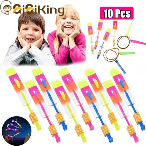 10PCS Outdoor Shining Rocket Flash LED Light Night Kids Luminous Slingshot Toys Shine Slingshot Elastic Helicopter Rotating Toy
