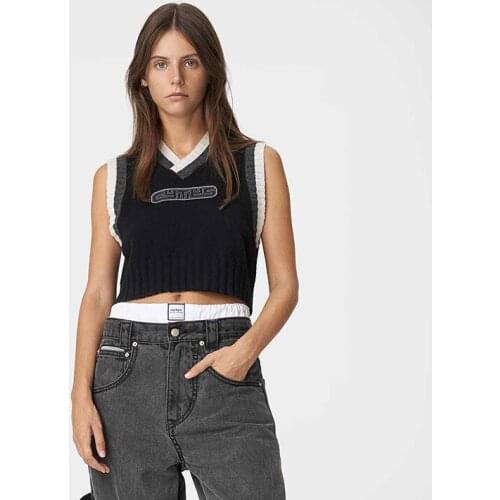 Chaleco del suéter del cuello en V de las mujeres, camisetas sin mangas casuales del punto del punto del modelo de la letra