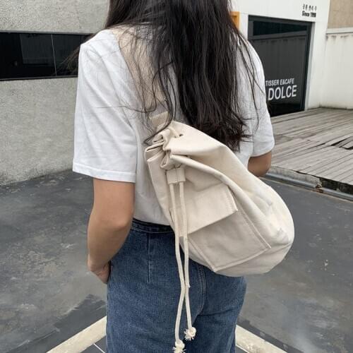 2020 new ins canvas bag fashion all-match solid color flip pocket shoulder messenger drawstring rope bucket bag student
