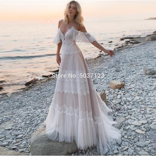2021 Bohemian Wedding Dresses Tempting Nude Champagne V Neck Chic Sleeves Straps Ruffles Lace A Line Backless Bridal Gowns