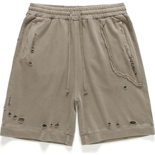 Kanye West Garment-Washed Cotton Sweat Shorts Distressed Holes Four-pocket styling Relaxed fit