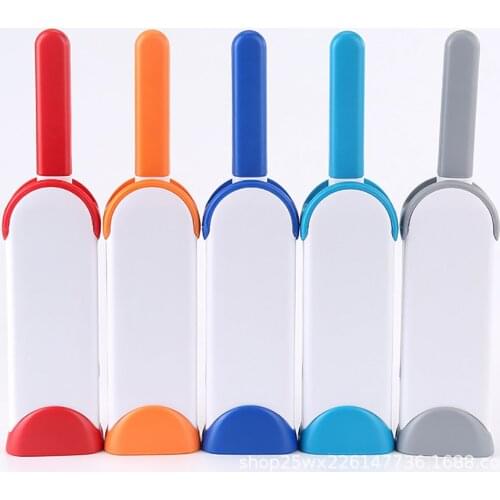 A set of double-sided multifunctional clothes dust removal brush cat and dog hair removal brush sofa hair sticking device