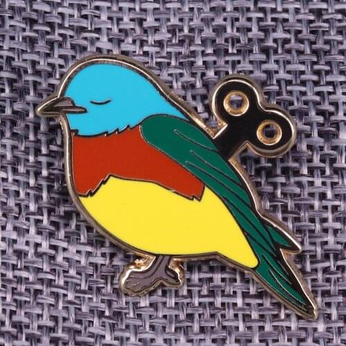 Clock bird pin badge