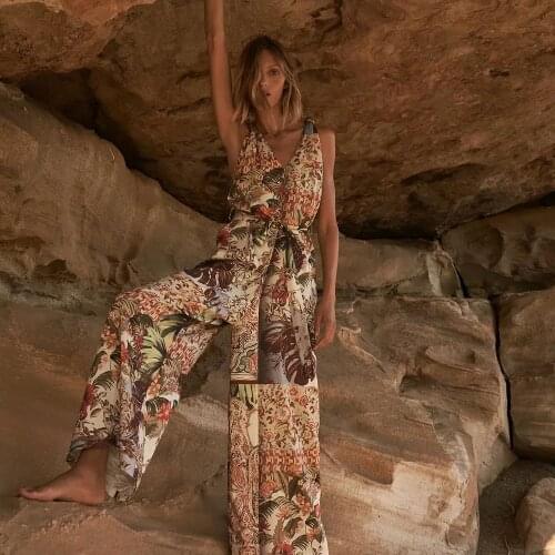 Xikom Women V Neck Slim Floral Print Sashes Jumpsuit Female Casual Jumpsuit Ladies Vintage Backless Sleeveless Jumpsuit