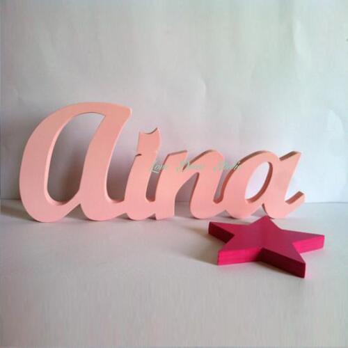 Pink letters wooden letters together in a star name also personalized