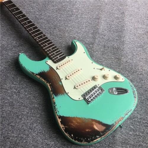 In stock, green antique relic, electric guitar, green guard board, cow bone string pillow. Nitro paint. Real photos. Free shippi