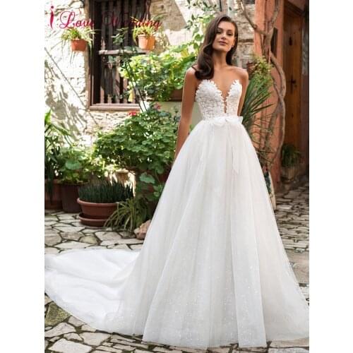 Beach Wedding Dress Sparkle Tulle Plunging V Neckline Appliques Sleeveless Backless with Bow Glamorous Women Wedding Party Gown