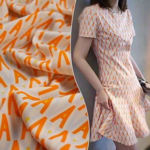 Half Meter Fashion Orange Letters A Print High Grade Silk Chiffon Fabric For Dress Cheongsam Overcoat Girl Garment Tissue T1697