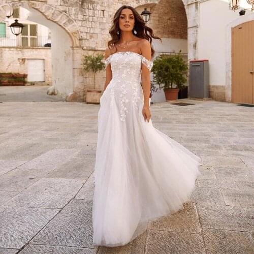 Elegant Off the Shoulder Wedding Dresses Simple Boat Neck Lace Appliques Empire Backless Bridal Gown Beach Robe De Marie 2021