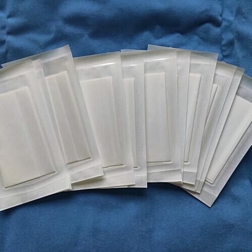 50pcs 10 * 15 15 * 25cm medical film covered PU waterproof non-woven self adhesive cloth block applied with black plaster paste