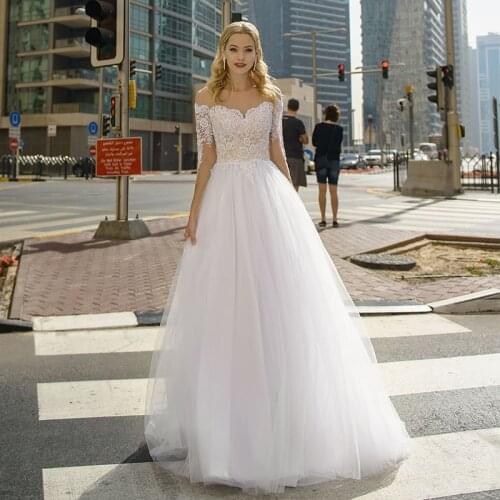 Tulle 3/4 Sleeve Wedding Dresses 2021 A-Line Sheer O-Neck Lace Appliques Sequins Floor Length Bridal Gown Button Sweep Train