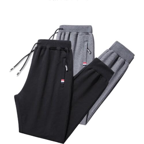 Cotton mens sports pants spring and autumn loose feet Korean style trendy pants large size casual pants long pants men