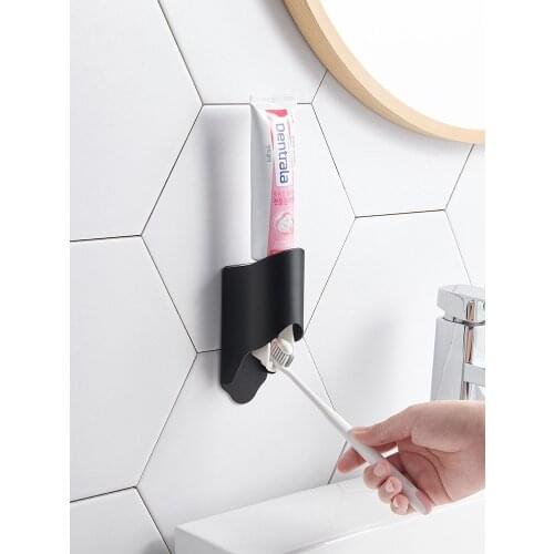 Creative wall mounted no punch toothpaste squeezer lazy squeeze toothpaste facial cleanser automatic squeeze washable