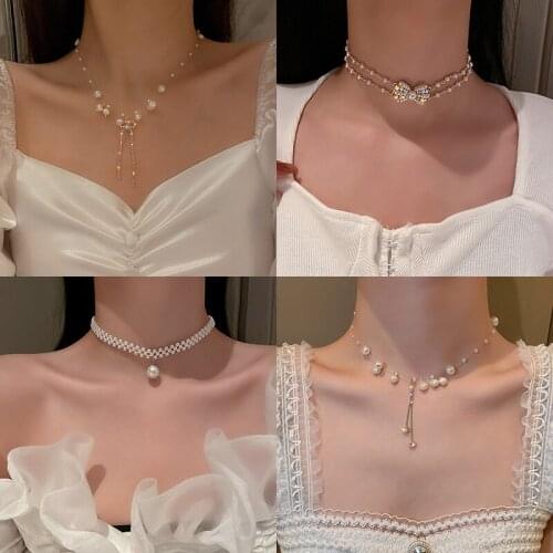 Pearl inlaid diamond tassel necklace ladies fashion sweet French temperament design sense flower bow girl neck clavicle chain