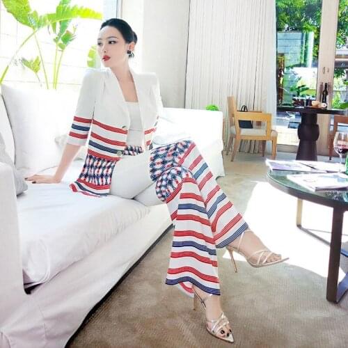 Summer bump OL professional suit women 2021 new fashion small suit drop feeling stitched micro flared pants two-piece set