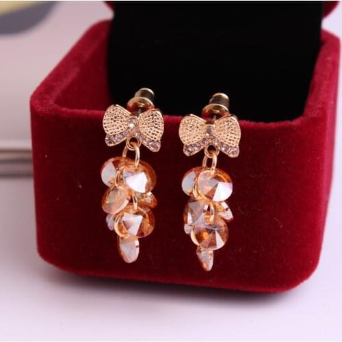 UNNAIER fashion personality Champagne gold Semi-precious stones grape Teardrop-shaped earring Female Bow Ear jewelry