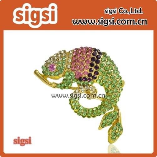 Green rhinestone lizard brooch