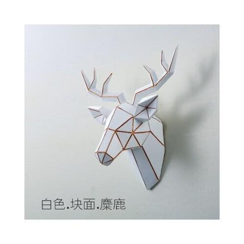 A deers head hangs from a wall deer head animal head three-dimensional pendant living room bedroom wall decoration photo