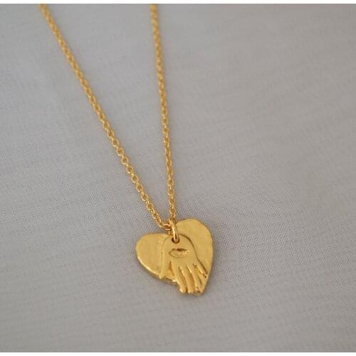 Europe and the United States retro Fatima palm heart printed irregular love pendant simple temperament necklace