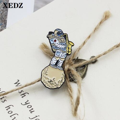 XEDZ astronaut enamel pin travel around space blowing saxophone fun brooch music lapel badge travel jewelry gift for friends