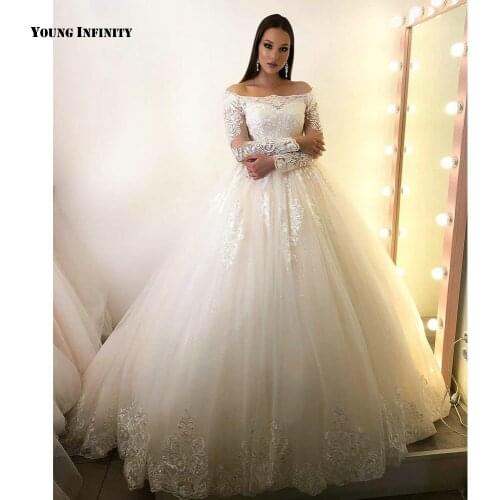 Romantic Ball Gown Wedding Dresses 2021 Long Sleeves Bridal Gown Lace Up Back Bateau Chapel Train Applique White Plus Size Bride