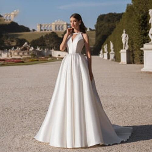 Glam Satin Pearls Sleeveless A-line Wedding Dress Ivory Skirt High Neck Sweep Train Boho Beach Dubai Arabic Bridal Gowns 2021