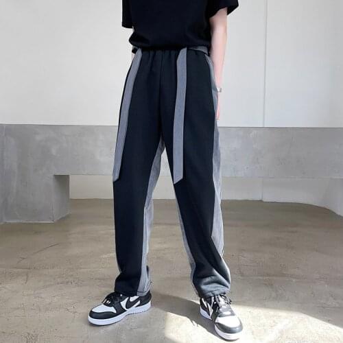 Large size early autumn personalized color blocking design feeling loose lace up small trousers trendy mens sports straight tub