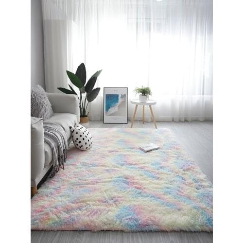 Carpet living room; coffee table; bedroom; covered with bedside blankets and cushions; with large area