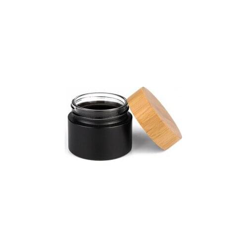 Bamboo CBD hemp eco friendly lotion container 30ml 50ml 100ml bamboo cosmetic packaging face cream black glass jar with wood lid