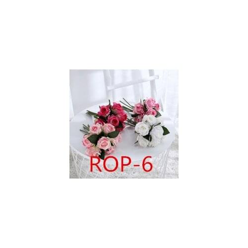 New wedding photographer sticks flower garden with decorative bouquet of grass ROP