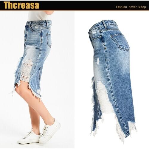 Spot foreign trade womens skirts Europe and the United States hot selling explosive models irregular tassels ripped denim skirt