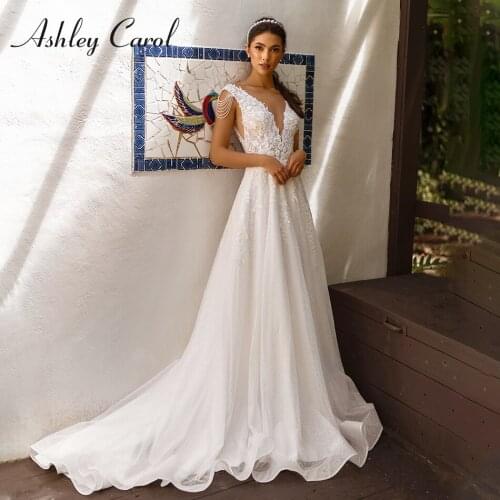 Ashley Carol A-Line Wedding Dress 2021 Charming Backless Beaded Lace Appliques Sleeveless V-Neck Bride Sparkly Beach Bridal Gown