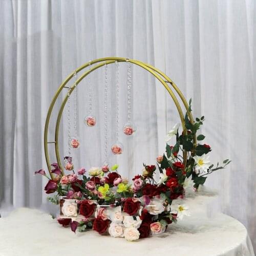 Golden hoop circle stand flower centerpiece for wedding reception