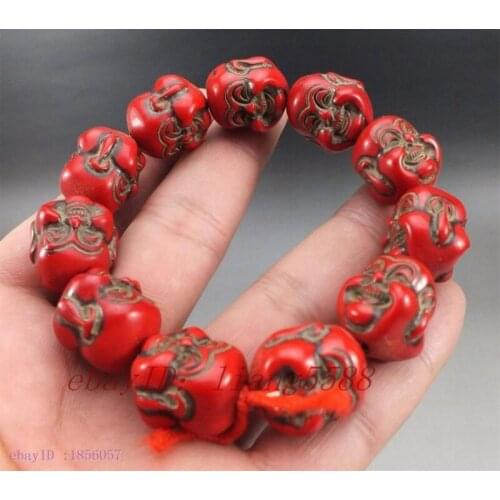Collection of old Chinese red coral happy Buddha bracelet
