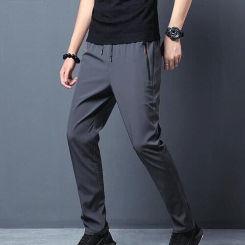 Fashion hot-selling mens trousers solid color quick-drying drawstring ankle tie zipper pocket sports slim trousers