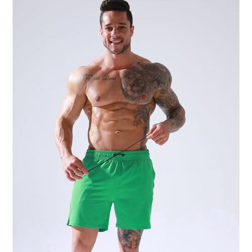 Hot Sale Mens Beach Shorts with Zipper Pockets Solid Color Skincare Elastic Volley Shorts with Mesh Lining Sportswear Bottoms