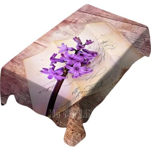 A Bouquet Of Purple Words On A Book With Photographic Patterns On A Tabletop Tablecloth Decorates Indoor And Outdoor Art