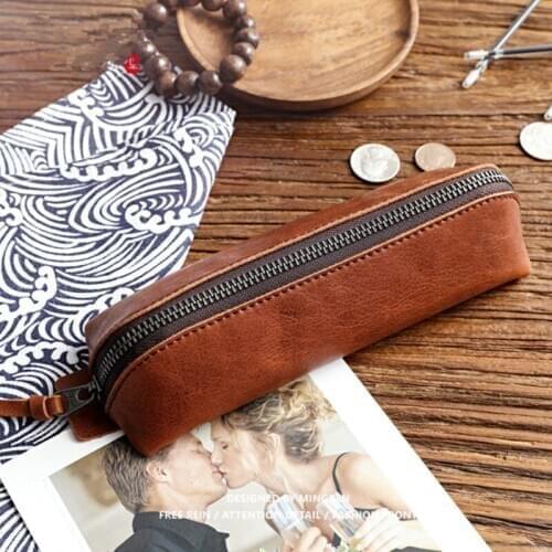 ERAL school supplies cowhide pencil bag. Italian cowhide handmade,It has a large capacity and can hold many pencils. The shape i