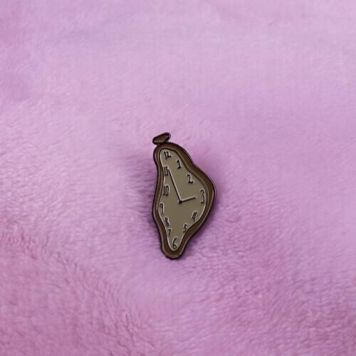 Salvador Dali clock pin inspired by "The Persistence of Memory" classic art jewelry