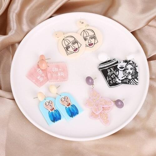 European and American fashion jewelry with butterfly heart text asymmetric cartoon smiley girl pink love women earrings