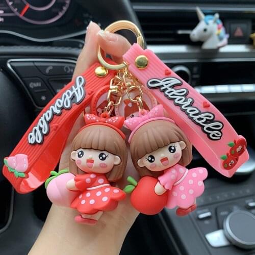 Cartoon girl heart student holding fruit little girl keychain pendant schoolbag doll doll pendant key ring