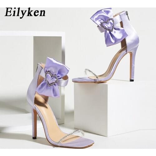 Eilyken 2021 Summer New Design Bowknot Buckle Crystal Sandals PVC Rhinestone Women Fashion Ankle Zipper Thin High Heels Shoes
