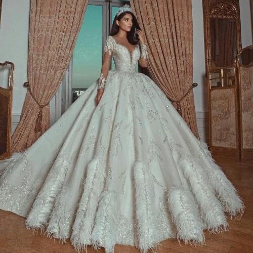 Luxurious A Line Wedding Dresses Sheer Long Sleeves Sequined Feathers Arabic Vintage Wedding Gowns Scoop Neck Long Train Robe De