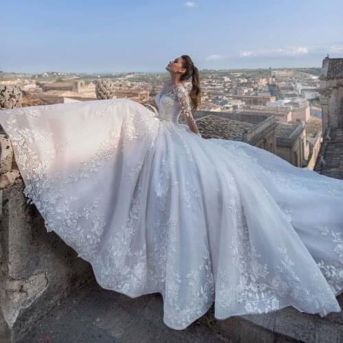 2021 Luxury Dubai Turkey Lace Wedding Dress Appliqued Illusion Full Sleeves O-neck Sexy Backless Gorgeous Long Bridal Gowns