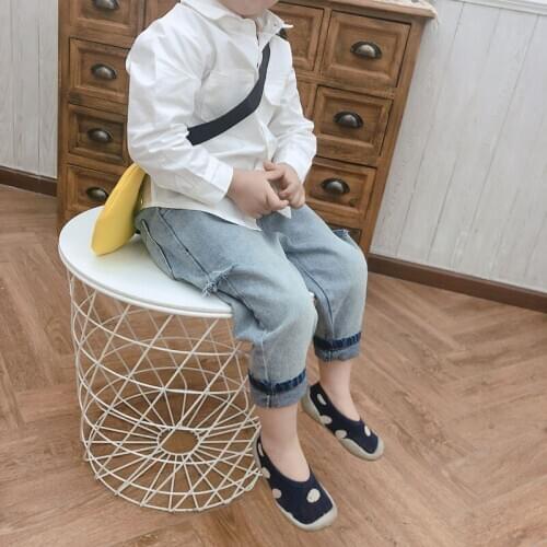 Spring and autumn new childrens fashion trend jeans boys and girls baby hole casual explosive models feet in the waist jeans