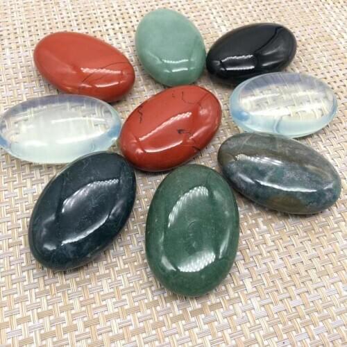 Quartz crystals palm stones natural stones and minerals polished massage gemstones spiritual healing decoration