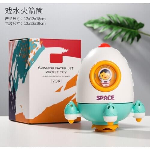 Childrens bathroom bathing, water spraying, little swans, rotating rockets, whales, and happy boys and girls bath toys